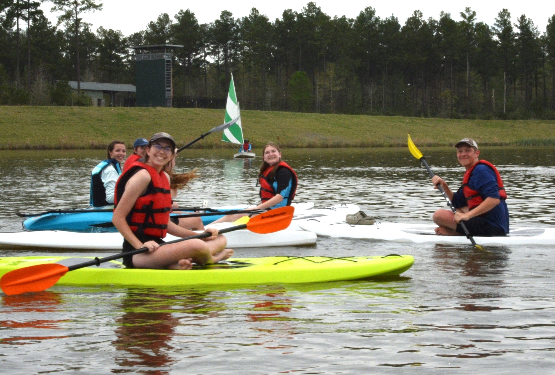 Caption: Sea Scout Ship Invincible’s on-water activities included paddling as well as power- and sailboating.